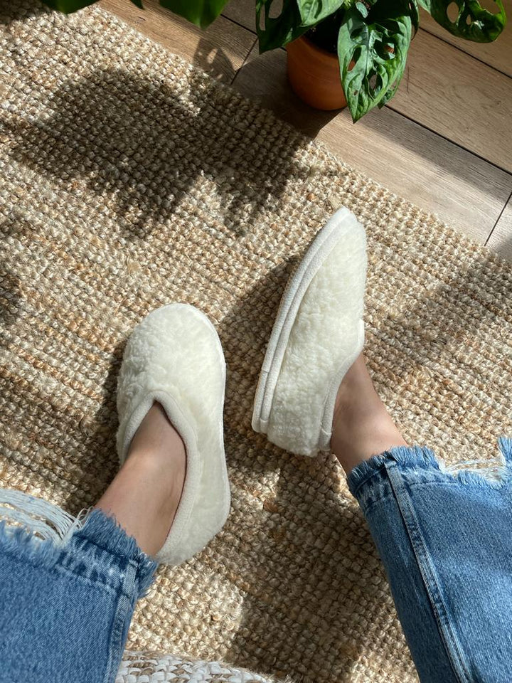 White slippers worn on a person&