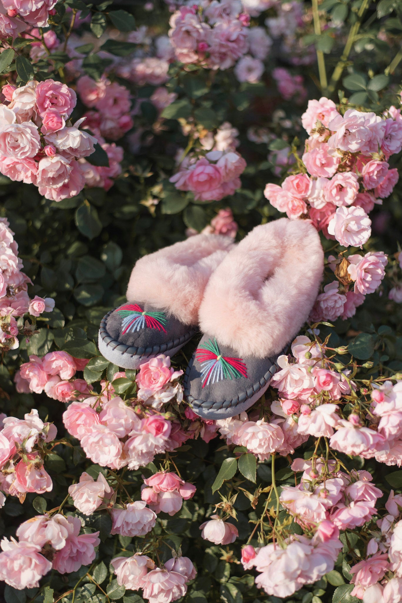 pink sheepskin slippers in roses